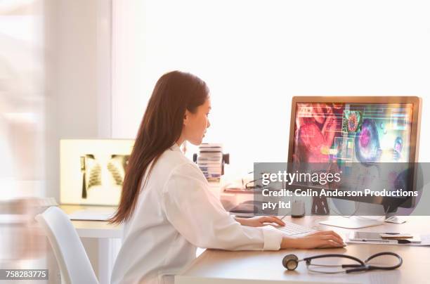 chinese doctor using computer - desktop reference guide stock pictures, royalty-free photos & images