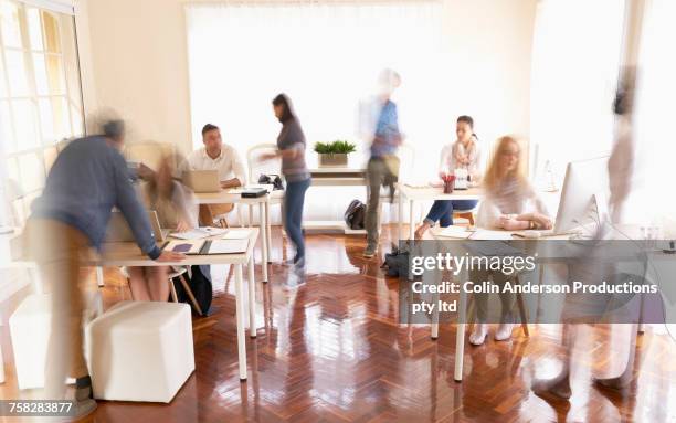 people working in busy office - busy office stock pictures, royalty-free photos & images