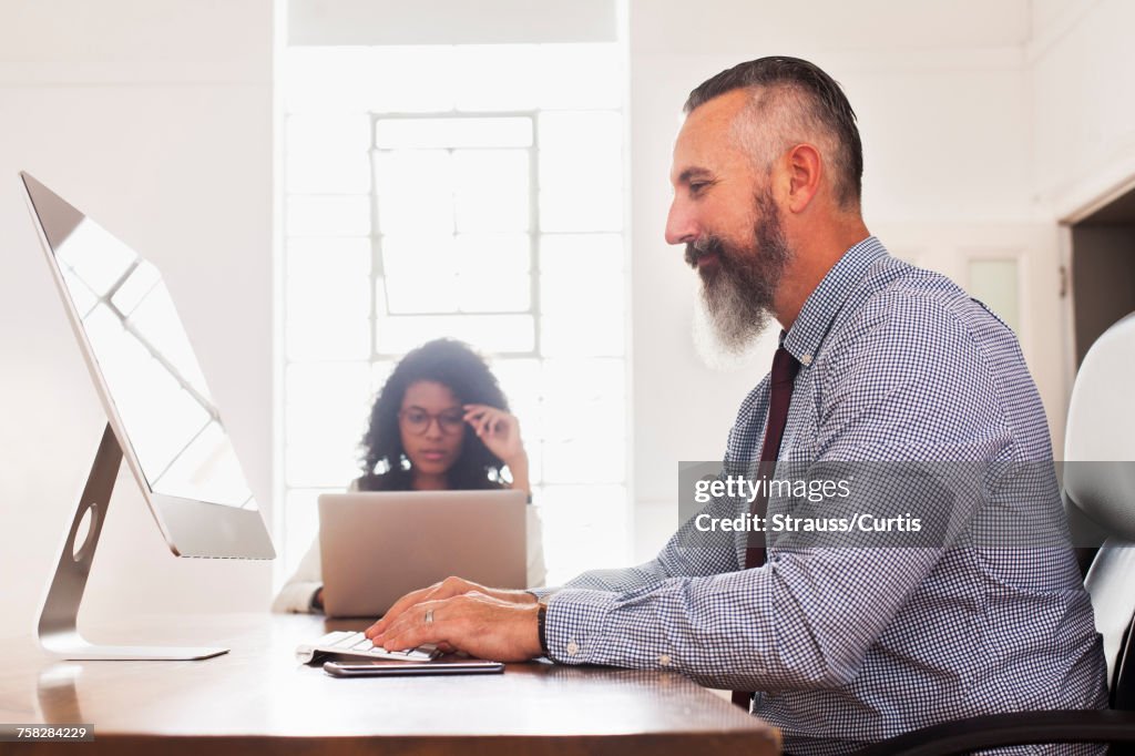 Man Using Computer Desk High-Res Stock Photo - Getty Images