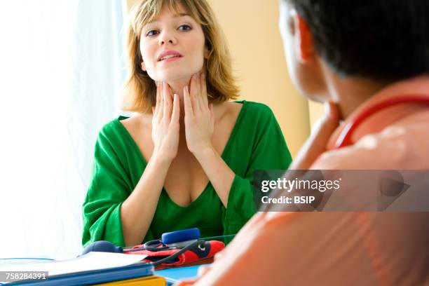 consultation,woman in pain - ganglion stock pictures, royalty-free photos & images
