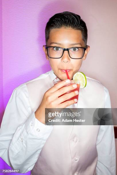 hispanic boy drinking beverage with a straw - birthday suit ストックフォトと画像