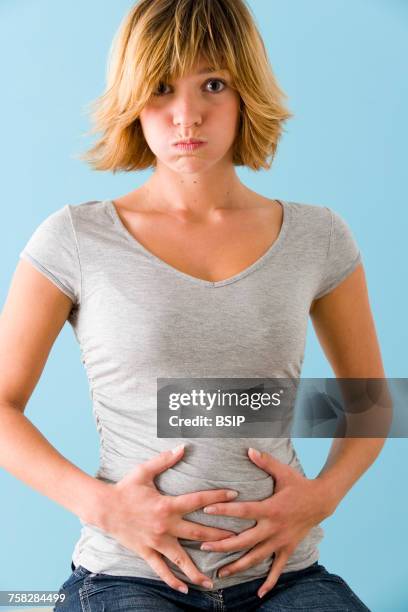 abdominal pain in a woman - bloating stock pictures, royalty-free photos & images