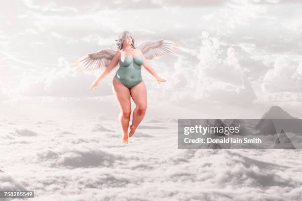 overweight angel flying in clouds - fat woman funny imagens e fotografias de stock