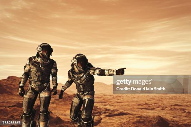 astronauts exploring planet - space man on mars imagens e fotografias de stock