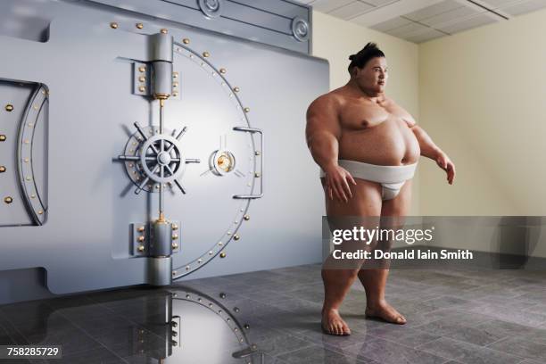 sumo wrestler guarding vault - sumo stock-fotos und bilder