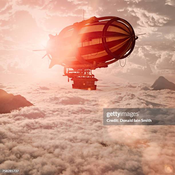 zeppelin flying above clouds - zeppelin stockfoto's en -beelden