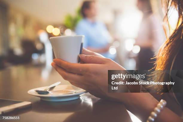 hands of woman holding a cup of coffee - saucer bildbanksfoton och bilder