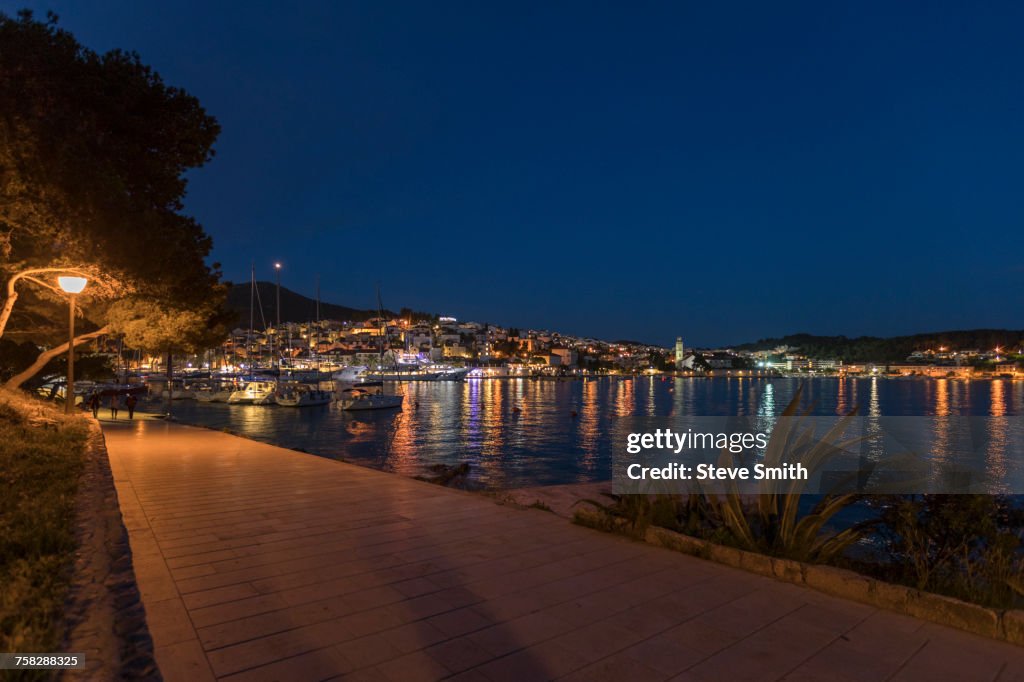 Scenic view of waterfront at night