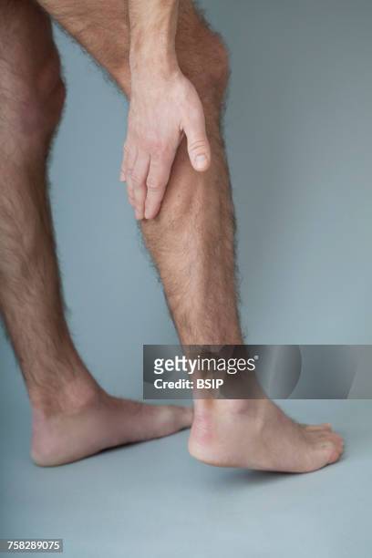 leg pain in a man - calf human leg stock pictures, royalty-free photos & images