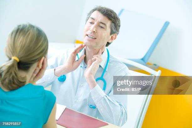 woman in consultation - ganglion stock pictures, royalty-free photos & images