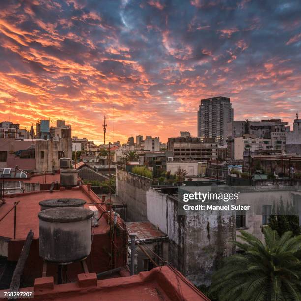 rooftop cityscape and dramatic sunset sky, san telmo, buenos aires, argentina - buenos aires rooftop stockfoto's en -beelden