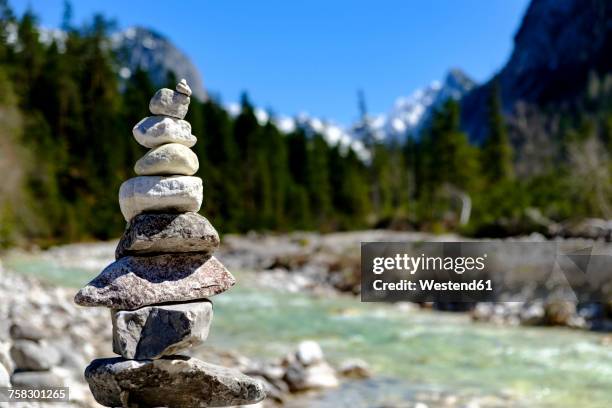 austria, tyrol, hinterautal, cairn at isar river - steinpyramide stock-fotos und bilder