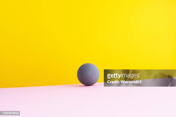 Sphere against yellow background, 3D Rendering
