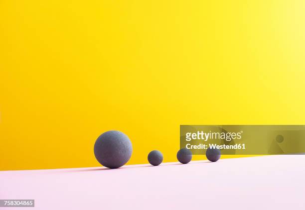 illustrazioni stock, clip art, cartoni animati e icone di tendenza di four spheres against yellow background, 3d rendering - sotto