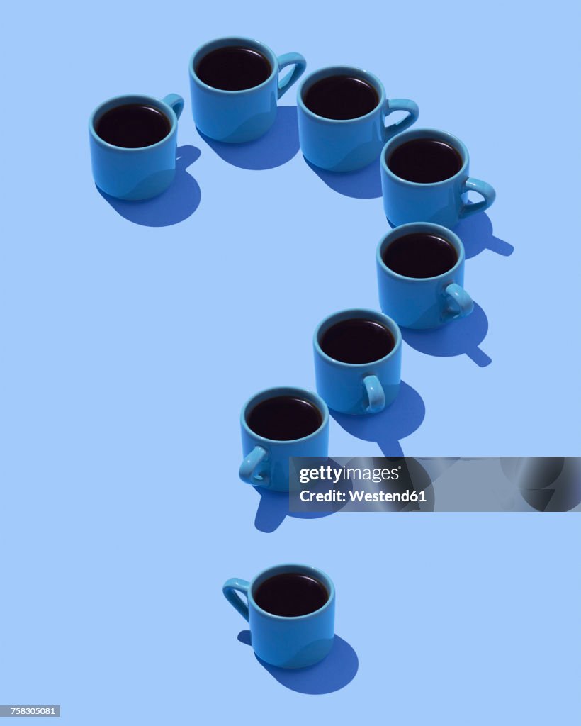 Question mark built of coffee mugs on light blue ground, 3D Rendering
