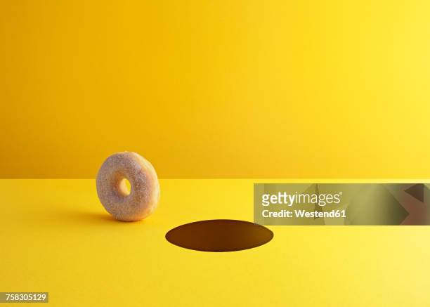 illustrazioni stock, clip art, cartoni animati e icone di tendenza di doughnut and hole on yellow ground - sfondo a colori
