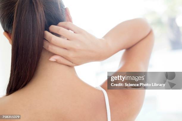 woman scratching neck - irritation skin woman stock pictures, royalty-free photos & images