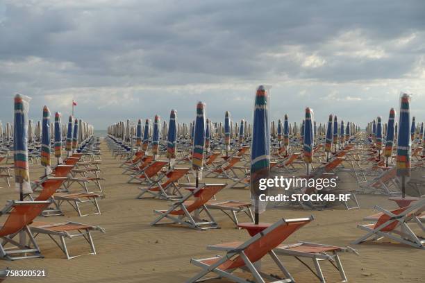 "italy, bibione, empty sun loungers" - bibione stock pictures, royalty-free photos & images