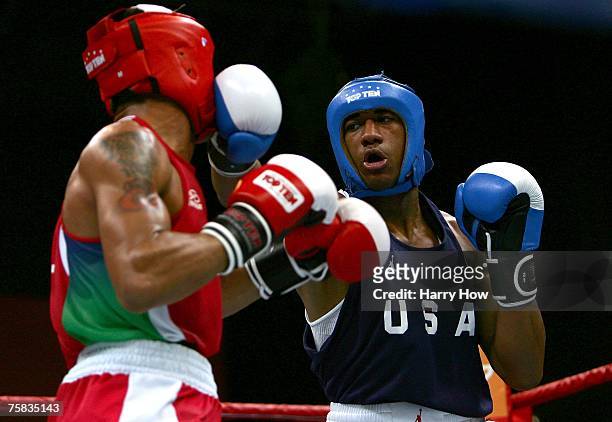 Demetrius Andrade of the United States lands a punch on Pedra Lima of Brazil on his way to a silver in the Welter 69 kg Boxing final in the 2007 XV...