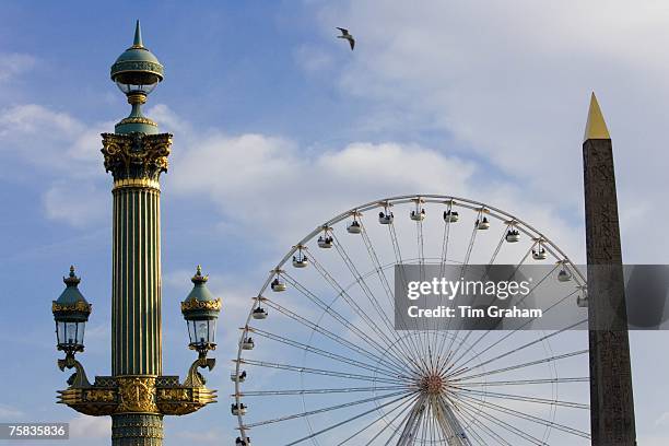 Obelisk of Luxor, period streetlight and Place de la Concorde ferris wheel called La Grande Roue, Central Paris, France