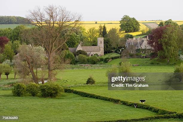 Asthall Manor House, village and Church of St Nicholas in The Cotswolds, Oxfordshire, United Kingdom