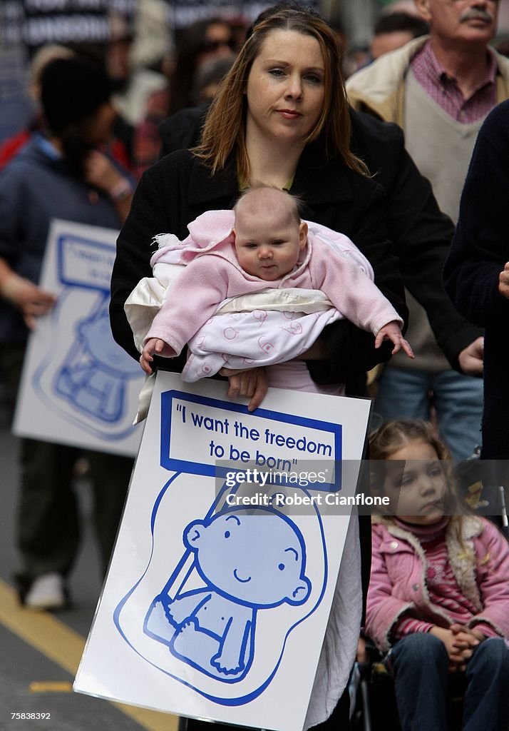 Protesting Babies A mother and her baby march during a protest on the steps of... News ...