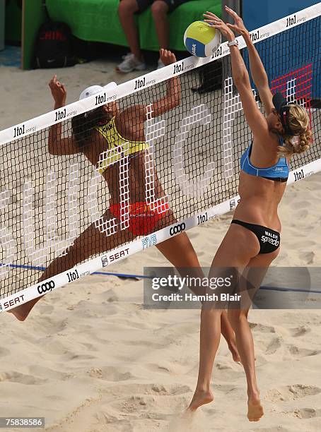 Kerri Walsh of USA blocks a shot from Chen Xue of China during the Women's Semi Final between Kerri Walsh and Misty May-Treanor of USA and Chen Xue...