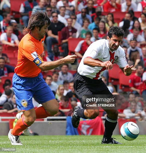 Inter Milan's Portuguese midfielder Luis Figo is challenged for the ball by Valencia's David Albelda during their Emirates Cup match at Arsenal FC's...