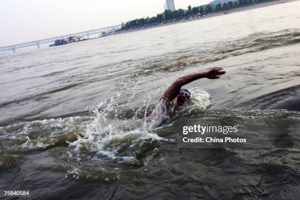 Swimmer swims at the river confluence where the Hanjiang River merges into the Yangtze River on July 28, 2007 in Wuhan of Hubei Province, central...