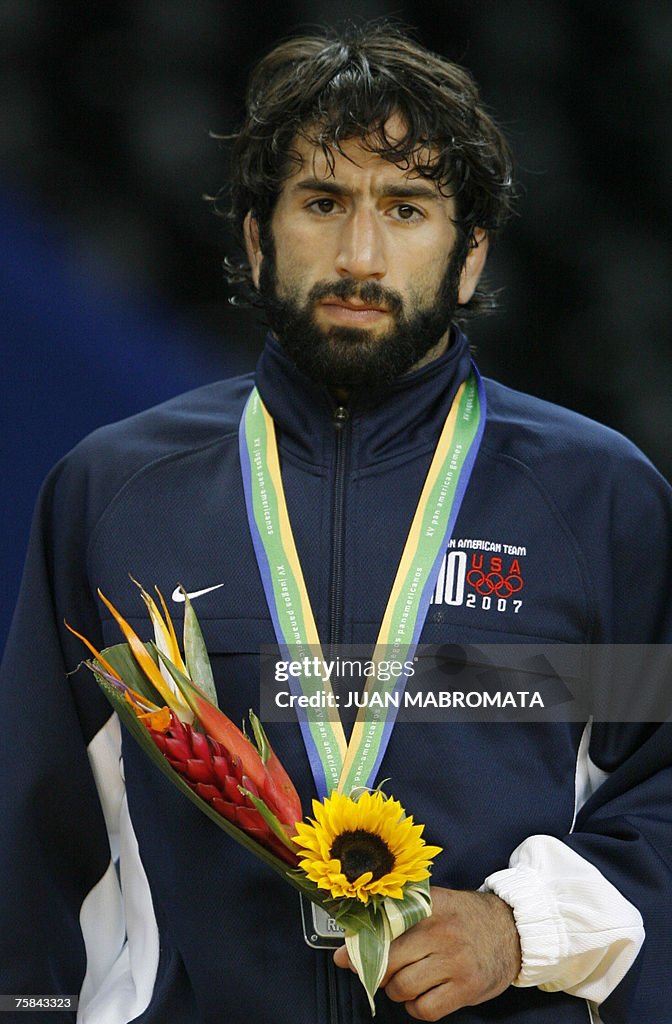 US Michael Zadick poses at the podium with his Silver Medal after losing with Cuba's Yandro Quintana the Men's 60Kg wrestling bout during the XV Pan American Games Rio-2007 in Rio de Janeiro, Brazil, July 28th 2007.    AFP PHOTO / JUAN MABROMATA (Photo credit should read JUAN MABROMATA/AFP via Getty Images)