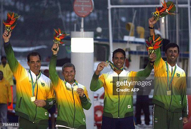 Brazilian Class J24 sailing team, Carlos Jord?o , Maur?cio Oliveira , Alexandre Silva and Daniel Santiago , celebrate their Gold medal in the XV Pan...