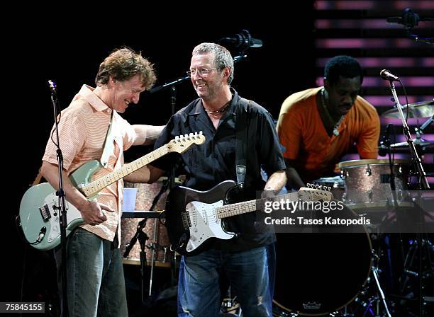 Musicians Steve Winwood, Eric Clapton and drummer Steve Jordan perform during the Crossroads Guitar Festival 2007 held at Toyota Park on July 28,...