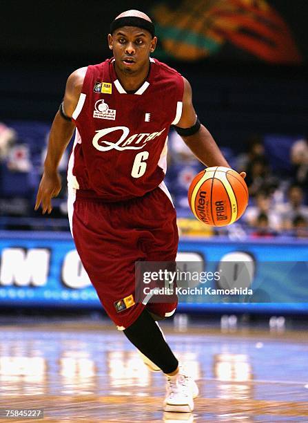 Saad Abdulrahman Ali of Qatar dribbles the ball up court against Indonesia during the 2007 FIBA Asia Championship first round game at Asty Tokushima...