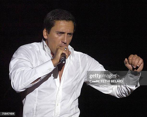 Franch singer Dany Brillant performs during the 43rd International Carthage Festival, 28 July 2007 at the Roman amphitheatre in Carthage, near Tunis....