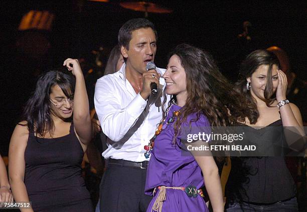 Franch singer Dany Brillant performs surrounded by a dancing public during the 43rd International Carthage Festival, 28 July 2007 at the Roman...