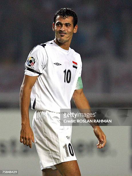 Iraqi forward Younis Mahmoud reacts after missing a shot on goal against Saudi Arabia during the Asian Football Cup 2007 final match at the Gelora...