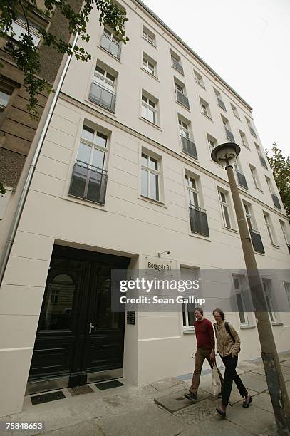 Two men walk past an apartment building in Borsigstrasse July 29, 2007 in Berlin, Germany. According to media reports American actor Brad Pitt and...