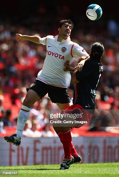 Javier Arizmendi of Valencia and no Mario Yepes of Paris St Germain challenge for the ball during the Emirates Cup match between Paris St Germain and...