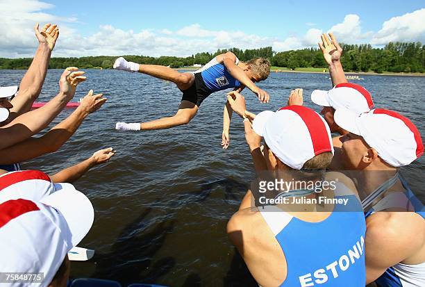 Nikita Lunin the Estonia cox is thrown into the lake after his teams success in the Eights final during the World Rowing U23 Championships at...
