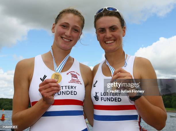 Heather Stanning and Olivia Whitlam of Great Britain celebrate with their trophies after winning Gold in the Pairs final during the World Rowing U23...