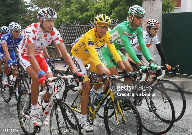 Polka Dot King of the Mountains jersey winner Juan Mauricio Soler Hernandez of Colombia and Barloworld, Yellow Jersey Alberto Contador of Spain and...