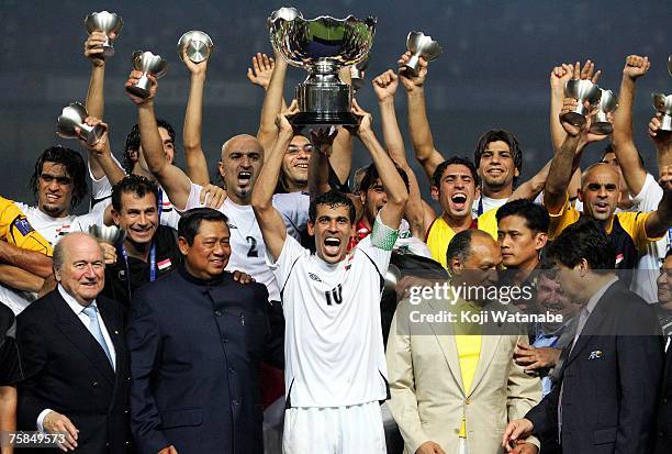 Younis Mahmoud of Iraq celebrates winning the AFC Asian Cup 2007 final against Saudi Arabia with his team mates, at Gelora Bung Karno Stadium july...