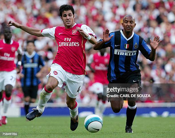 Arsenal's Francesc Fabregas of Spain and Inter Milan's Olivier Dacourt of France vie during their Emirates Cup match at the Emirates Stadium, London,...