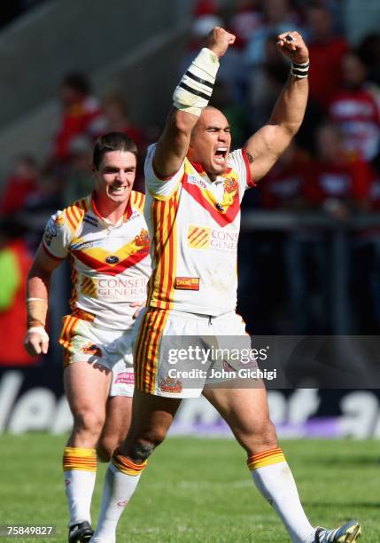 Luke Quigley and Mathieu Griffi of Catalan Dragons celebrate their team's victory at the end of the Carnegie Challenge Cup Semi-Final match between...