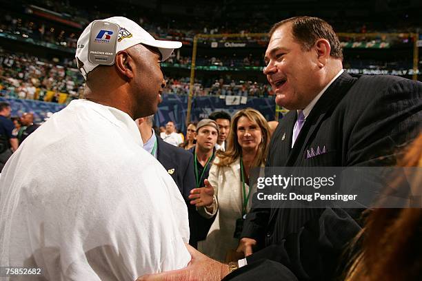 Commissioner David Baker congratulates head coach Darren Arbet of the San Jose SaberCats after the SaberCats 55-33 victory against the Columbus...