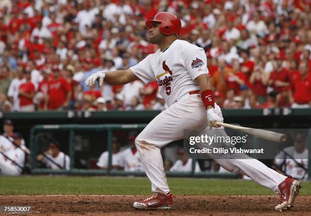 Albert Pujols of the St. Louis Cardinals knocks in three runs against the Milwaukee Brewers at Busch Stadium July 29, 2007 in St. Louis, Missouri....