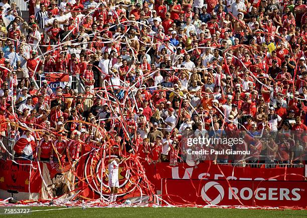 Toronto FC fans shower Chicago Fire forward Cuauhtemoc Blanco with paper streamers as he sets up for a corner kick during the match between Chicago...