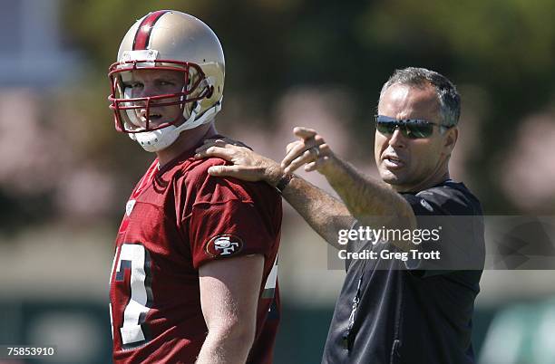 Head coach Mike Nolan works with tight end Billy Bajema as the San Francisco 49ers start their training camp on July 29, 2007 at Santa Clara,...