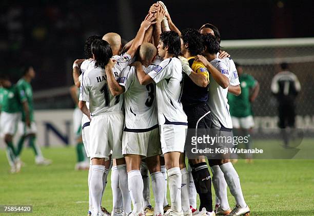 The Iraq team huddle at the start of the second half of the AFC Asian Cup 2007 final between Iraq and Saudi Arabia at Gelora Bung Karno Stadium on...
