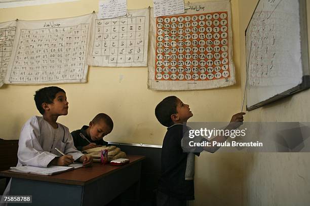 Young boys learn to write at the Turquoise Mountain Foundation on July 29, 2007 in Kabul, Afghanistan.The non-profit organization opened last year,...